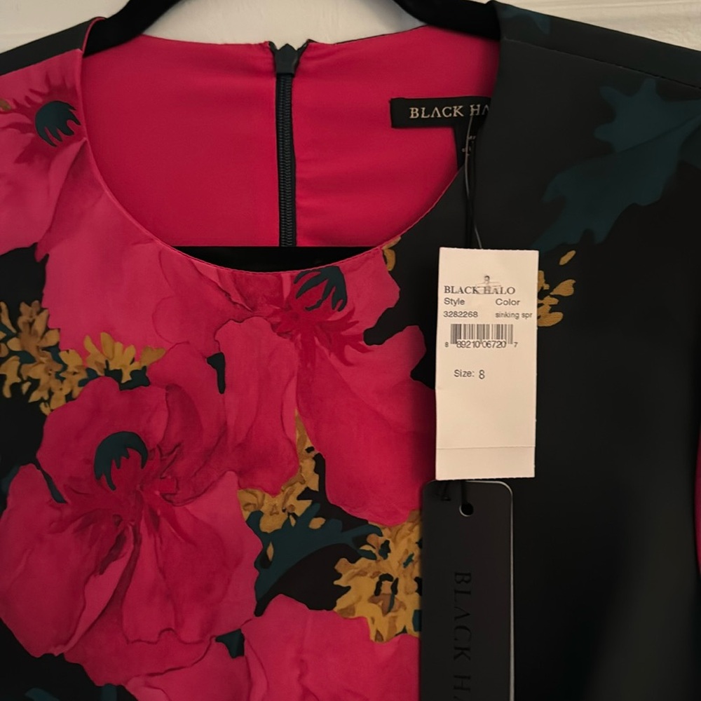 Black Halo dress.  Dark green background with fuscia floral pattern.